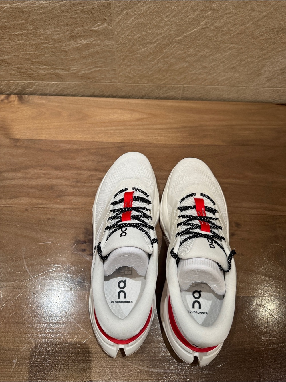 On Running Men's White Sneakers with Black Laces and Red Tabs